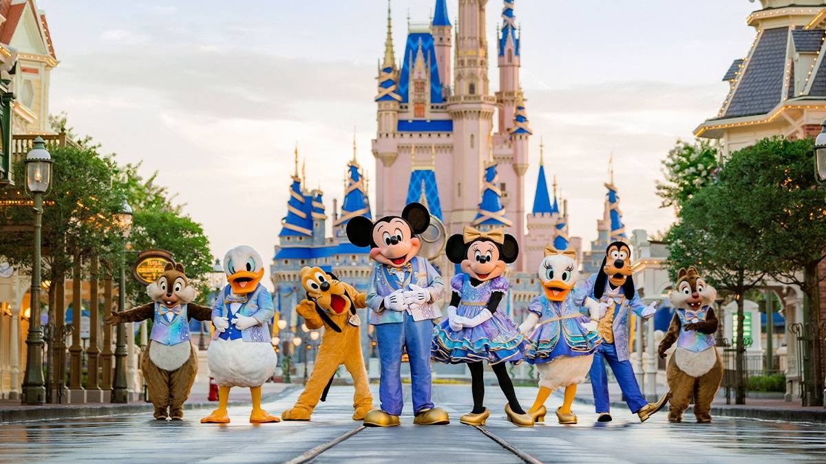 Mickey, Minnie, Donald, Goofy, Pluto and Chip and Dale posed on Main Street in front of Cinderella Castle at Walt Disney World